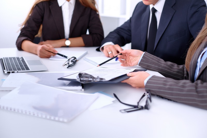 Group of business people at a meeting against the background of the office